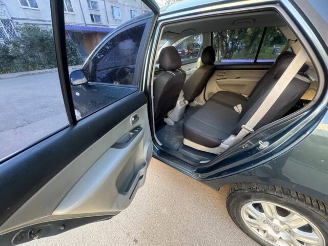 Синий Киа Каренс, объемом двигателя 2 л и пробегом 236 тыс. км за 5950 $, фото 14 на Automoto.ua