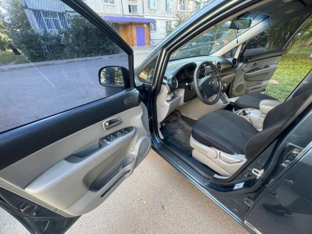 Синий Киа Каренс, объемом двигателя 2 л и пробегом 236 тыс. км за 5950 $, фото 15 на Automoto.ua