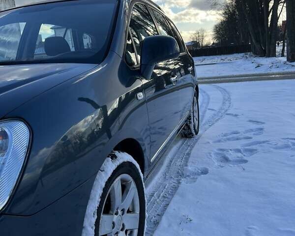 Синій Кіа Каренс, об'ємом двигуна 2 л та пробігом 233 тис. км за 7700 $, фото 2 на Automoto.ua