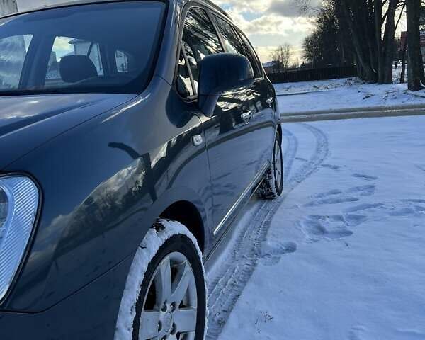 Синій Кіа Каренс, об'ємом двигуна 2 л та пробігом 233 тис. км за 7700 $, фото 4 на Automoto.ua