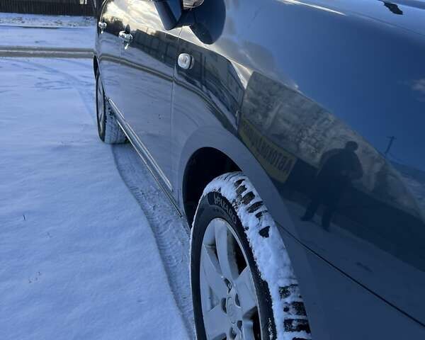 Синій Кіа Каренс, об'ємом двигуна 2 л та пробігом 233 тис. км за 7700 $, фото 1 на Automoto.ua