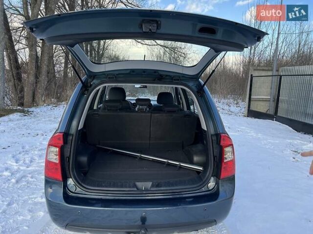 Синій Кіа Каренс, об'ємом двигуна 2 л та пробігом 233 тис. км за 7700 $, фото 3 на Automoto.ua