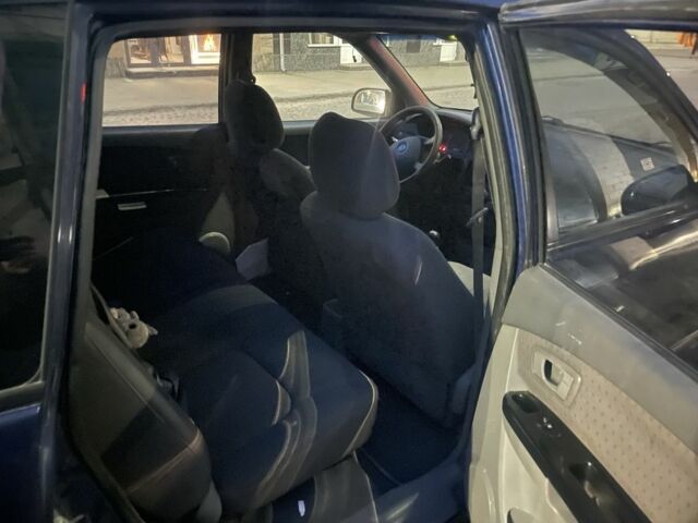 Синий Киа Каренс, объемом двигателя 2 л и пробегом 260 тыс. км за 3200 $, фото 6 на Automoto.ua