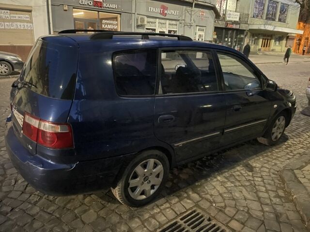 Синий Киа Каренс, объемом двигателя 2 л и пробегом 260 тыс. км за 3200 $, фото 3 на Automoto.ua