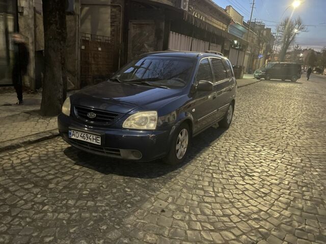Синий Киа Каренс, объемом двигателя 2 л и пробегом 260 тыс. км за 3200 $, фото 1 на Automoto.ua