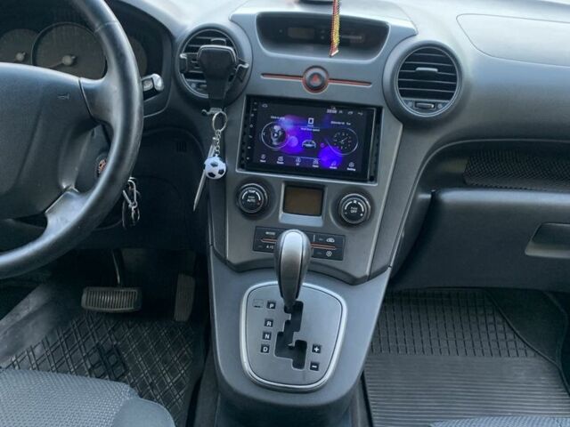 Синий Киа Каренс, объемом двигателя 2 л и пробегом 234 тыс. км за 6500 $, фото 2 на Automoto.ua