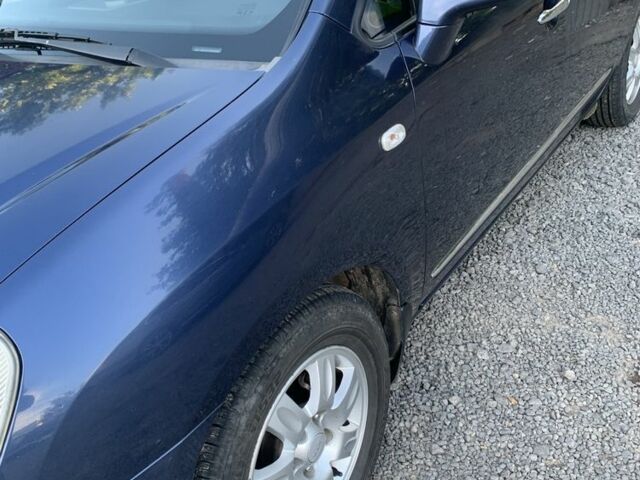 Синий Киа Каренс, объемом двигателя 2 л и пробегом 234 тыс. км за 6500 $, фото 1 на Automoto.ua