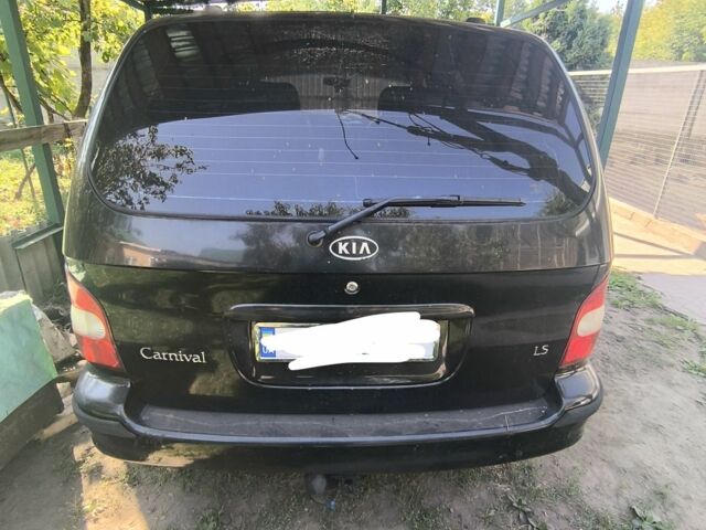 Чорний Кіа Карнівал, об'ємом двигуна 3 л та пробігом 300 тис. км за 1450 $, фото 9 на Automoto.ua