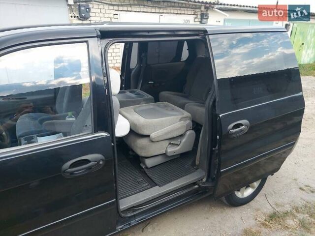 Черный Киа Карнивал, объемом двигателя 2.9 л и пробегом 294 тыс. км за 4000 $, фото 14 на Automoto.ua