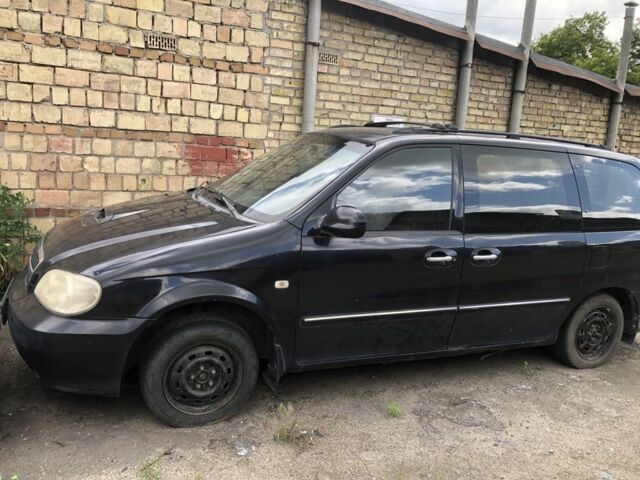 Черный Киа Карнивал, объемом двигателя 2.9 л и пробегом 200 тыс. км за 2000 $, фото 1 на Automoto.ua