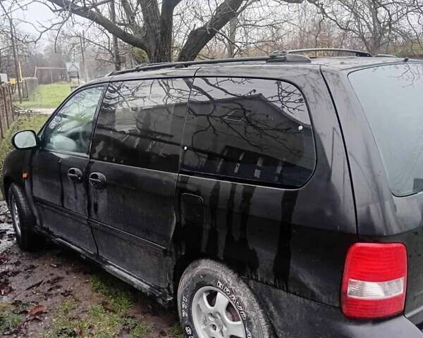 Черный Киа Карнивал, объемом двигателя 2.8 л и пробегом 300 тыс. км за 3800 $, фото 4 на Automoto.ua