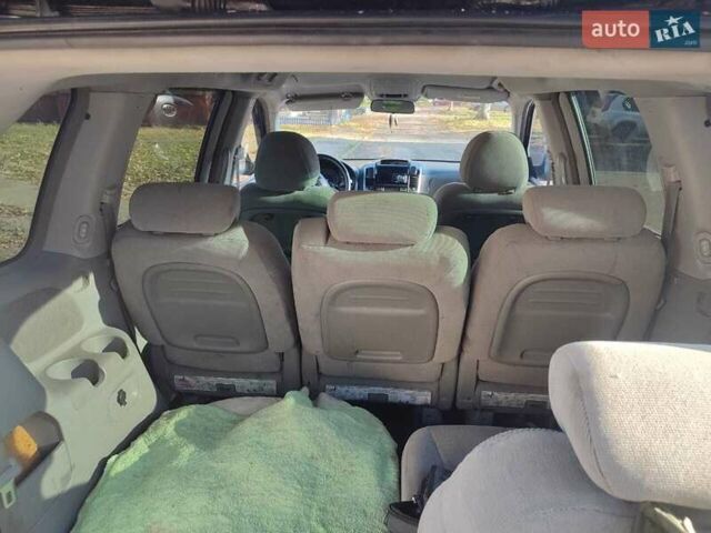 Черный Киа Карнивал, объемом двигателя 2.66 л и пробегом 310 тыс. км за 5800 $, фото 12 на Automoto.ua