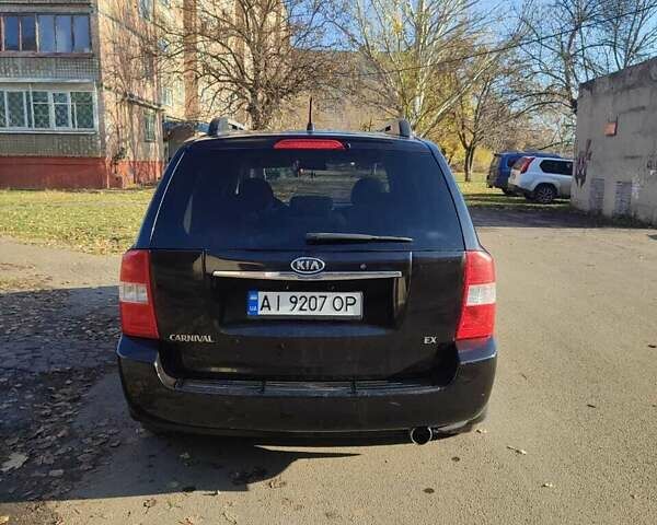 Черный Киа Карнивал, объемом двигателя 2.66 л и пробегом 310 тыс. км за 5800 $, фото 5 на Automoto.ua