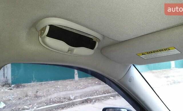 Черный Киа Карнивал, объемом двигателя 2.66 л и пробегом 310 тыс. км за 5800 $, фото 22 на Automoto.ua