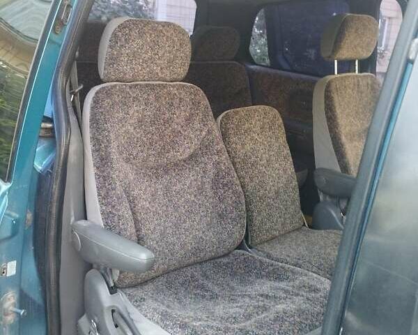 Синій Кіа Карнівал, об'ємом двигуна 2.92 л та пробігом 300 тис. км за 1999 $, фото 2 на Automoto.ua