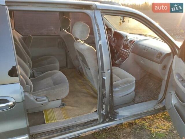 Синий Киа Карнивал, объемом двигателя 2.9 л и пробегом 240 тыс. км за 2450 $, фото 4 на Automoto.ua