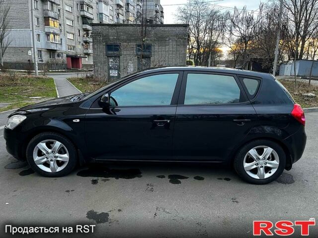 Чорний Кіа Сід, об'ємом двигуна 20 л та пробігом 143 тис. км за 7690 $, фото 1 на Automoto.ua