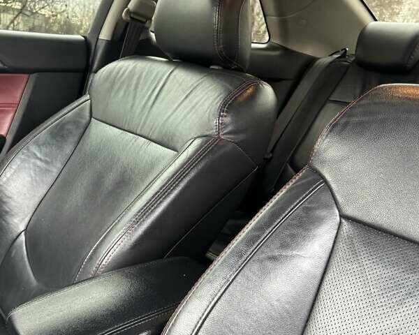 Білий Кіа Cerato KOUP, об'ємом двигуна 2 л та пробігом 174 тис. км за 8500 $, фото 13 на Automoto.ua