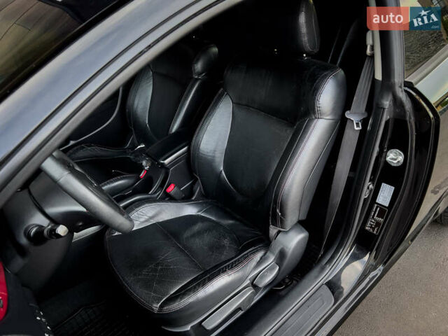 Чорний Кіа Cerato KOUP, об'ємом двигуна 2 л та пробігом 265 тис. км за 6800 $, фото 24 на Automoto.ua