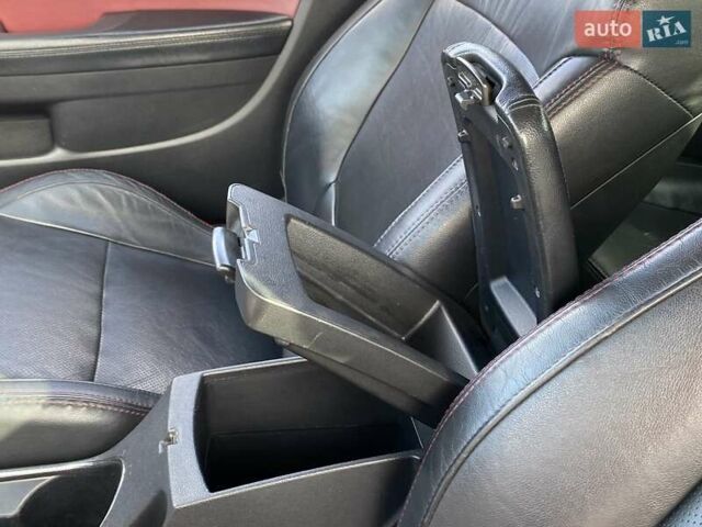 Красный Киа Cerato KOUP, объемом двигателя 2 л и пробегом 107 тыс. км за 10200 $, фото 24 на Automoto.ua