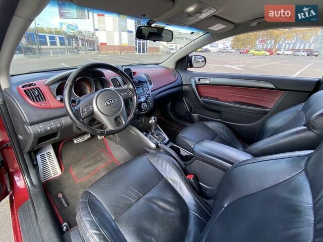 Красный Киа Cerato KOUP, объемом двигателя 2 л и пробегом 107 тыс. км за 10200 $, фото 17 на Automoto.ua