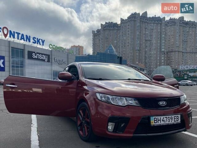 Красный Киа Cerato KOUP, объемом двигателя 2 л и пробегом 107 тыс. км за 10200 $, фото 5 на Automoto.ua