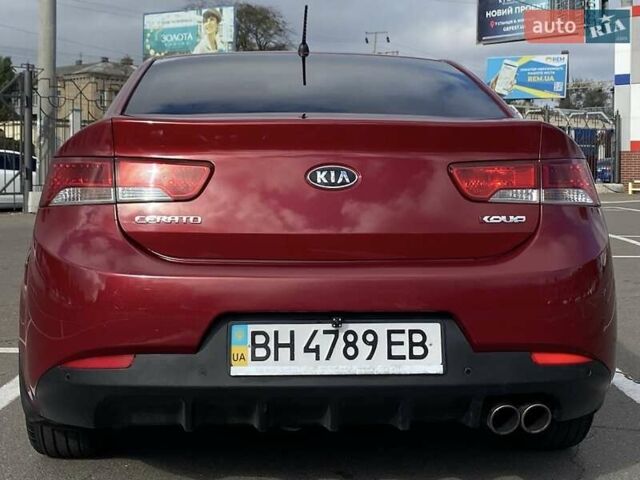 Красный Киа Cerato KOUP, объемом двигателя 2 л и пробегом 107 тыс. км за 10200 $, фото 6 на Automoto.ua