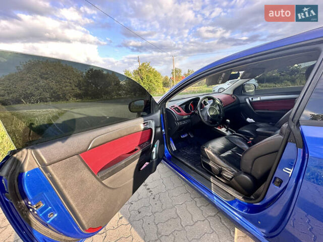 Синий Киа Cerato KOUP, объемом двигателя 2 л и пробегом 144 тыс. км за 8350 $, фото 24 на Automoto.ua