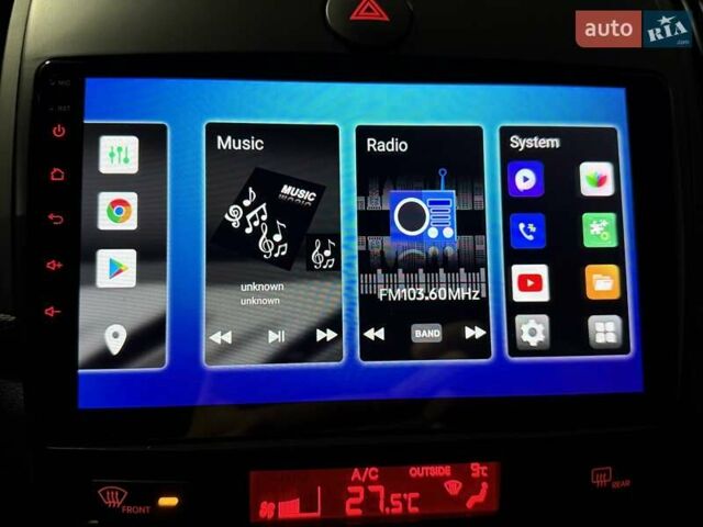 Білий Кіа Черато, об'ємом двигуна 2 л та пробігом 150 тис. км за 11400 $, фото 26 на Automoto.ua