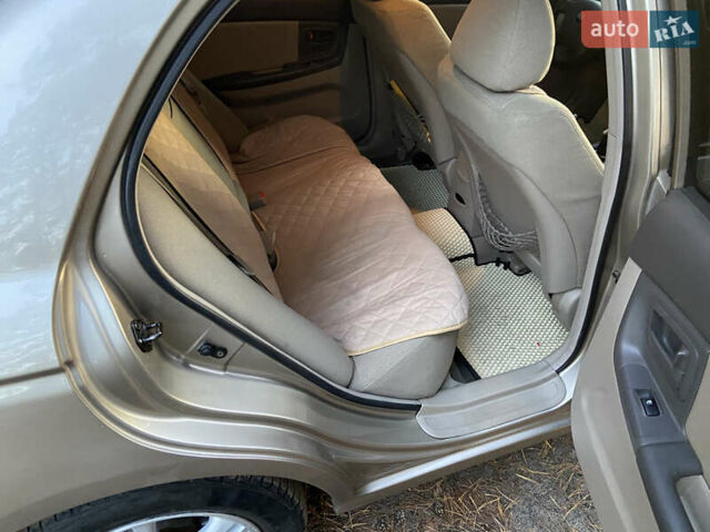 Бежевий Кіа Черато, об'ємом двигуна 1.6 л та пробігом 285 тис. км за 5300 $, фото 25 на Automoto.ua