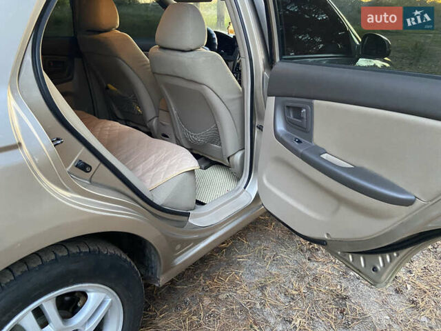 Бежевий Кіа Черато, об'ємом двигуна 1.6 л та пробігом 285 тис. км за 5300 $, фото 24 на Automoto.ua