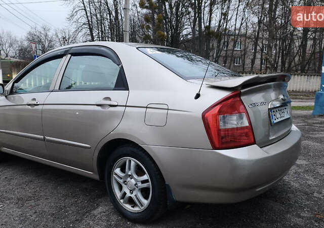 Бежевый Киа Черато, объемом двигателя 1.59 л и пробегом 202 тыс. км за 4800 $, фото 7 на Automoto.ua