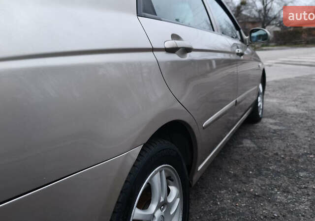 Бежевый Киа Черато, объемом двигателя 1.59 л и пробегом 202 тыс. км за 4800 $, фото 19 на Automoto.ua