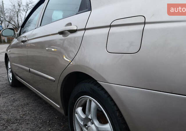 Бежевый Киа Черато, объемом двигателя 1.59 л и пробегом 202 тыс. км за 4800 $, фото 18 на Automoto.ua