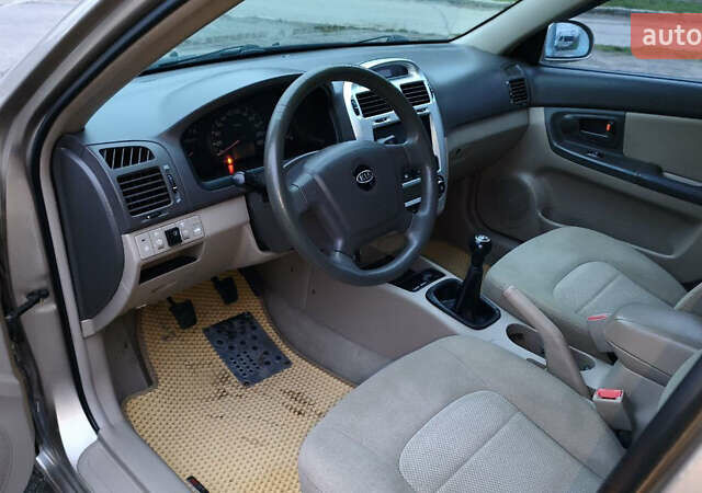 Бежевый Киа Черато, объемом двигателя 1.59 л и пробегом 202 тыс. км за 4800 $, фото 28 на Automoto.ua