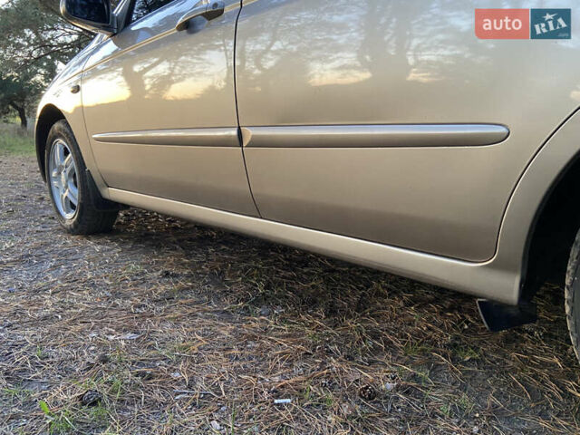 Бежевий Кіа Черато, об'ємом двигуна 1.6 л та пробігом 285 тис. км за 5300 $, фото 16 на Automoto.ua