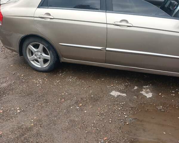 Бежевый Киа Черато, объемом двигателя 2 л и пробегом 245 тыс. км за 4500 $, фото 9 на Automoto.ua