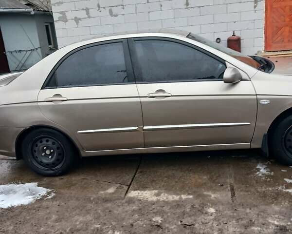 Бежевый Киа Черато, объемом двигателя 2 л и пробегом 245 тыс. км за 4500 $, фото 22 на Automoto.ua