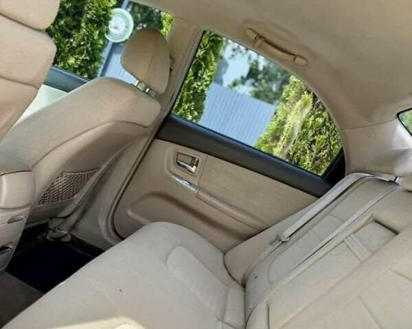 Бежевий Кіа Черато, об'ємом двигуна 2 л та пробігом 250 тис. км за 3500 $, фото 3 на Automoto.ua