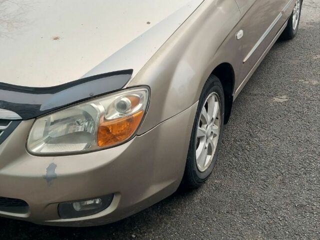 Бежевий Кіа Черато, об'ємом двигуна 2 л та пробігом 222 тис. км за 4900 $, фото 5 на Automoto.ua