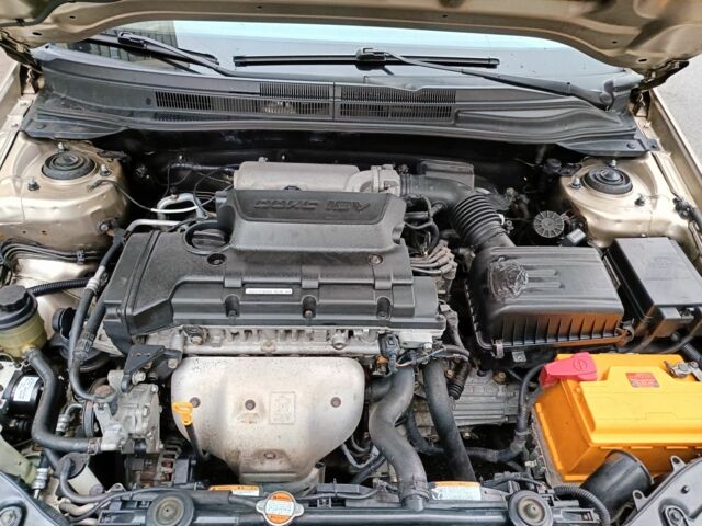 Бежевый Киа Черато, объемом двигателя 2 л и пробегом 195 тыс. км за 4250 $, фото 12 на Automoto.ua