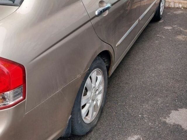 Бежевий Кіа Черато, об'ємом двигуна 2 л та пробігом 222 тис. км за 4900 $, фото 6 на Automoto.ua