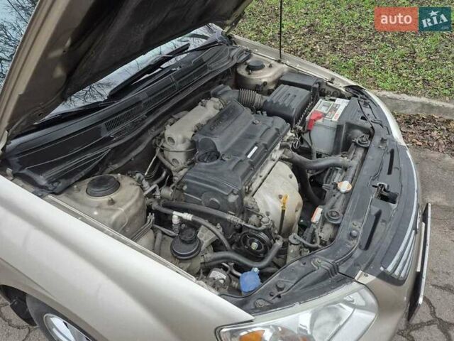 Бежевый Киа Черато, объемом двигателя 2 л и пробегом 210 тыс. км за 5300 $, фото 16 на Automoto.ua