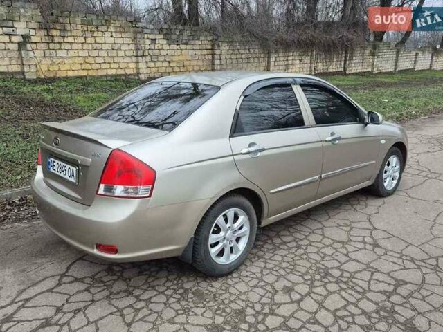 Бежевый Киа Черато, объемом двигателя 2 л и пробегом 210 тыс. км за 5300 $, фото 4 на Automoto.ua