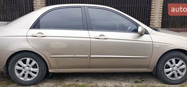 Бежевий Кіа Черато, об'ємом двигуна 1.6 л та пробігом 215 тис. км за 4000 $, фото 6 на Automoto.ua