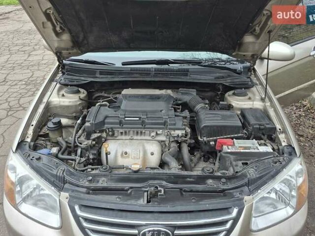 Бежевый Киа Черато, объемом двигателя 2 л и пробегом 210 тыс. км за 5300 $, фото 15 на Automoto.ua