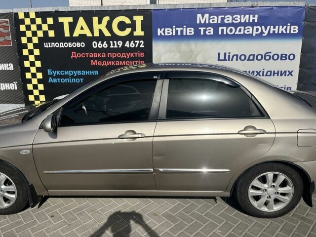Бежевий Кіа Черато, об'ємом двигуна 1.6 л та пробігом 247 тис. км за 5100 $, фото 3 на Automoto.ua