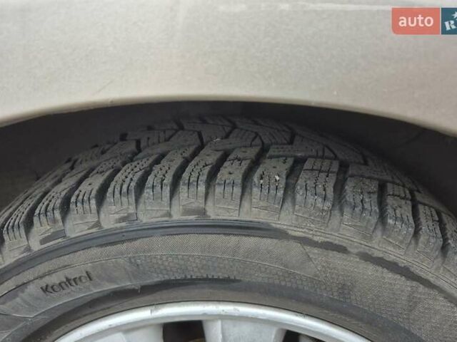 Бежевый Киа Черато, объемом двигателя 2 л и пробегом 210 тыс. км за 5300 $, фото 18 на Automoto.ua