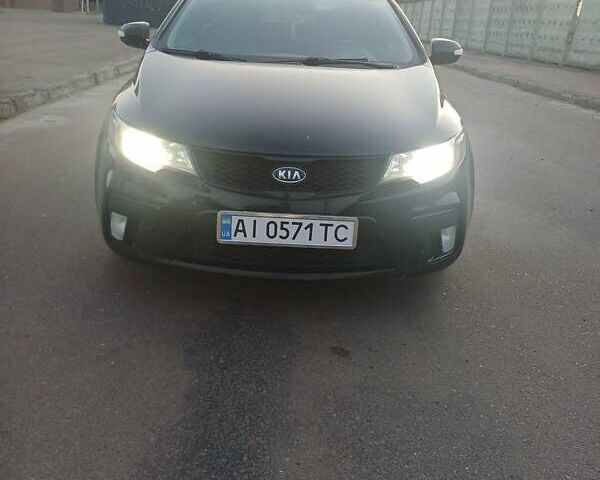 Чорний Кіа Черато, об'ємом двигуна 2 л та пробігом 261 тис. км за 7399 $, фото 1 на Automoto.ua
