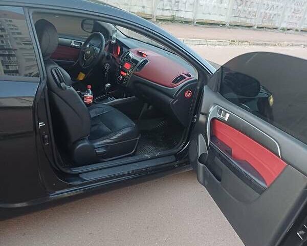 Чорний Кіа Черато, об'ємом двигуна 2 л та пробігом 261 тис. км за 7399 $, фото 8 на Automoto.ua